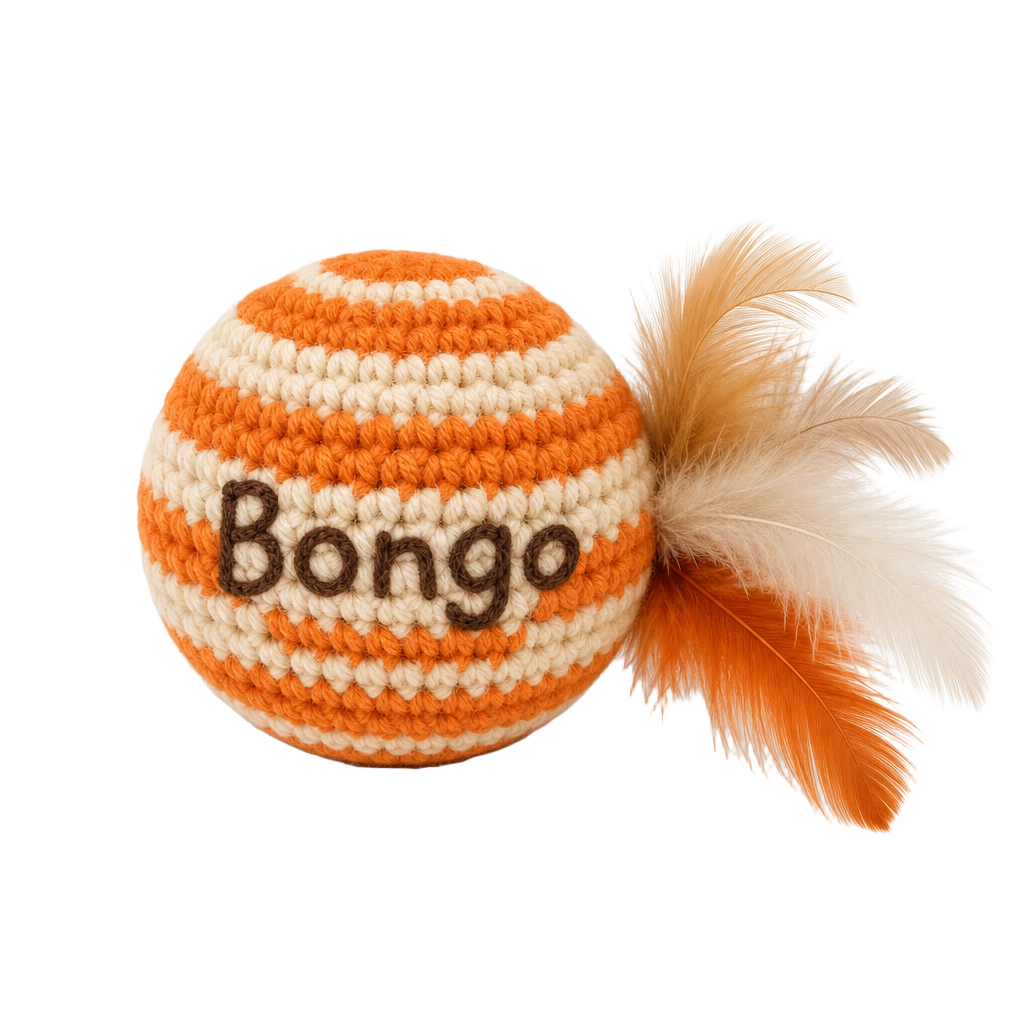 Orange and cream crochet Bongo cat ball with feathers